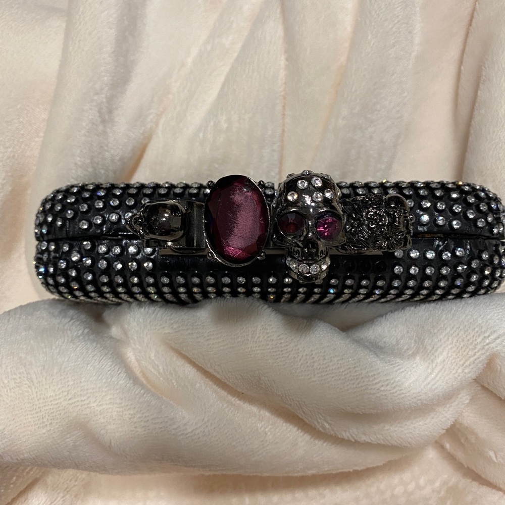 Jeweled knuckle clutch with velvet lining